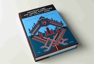 Render an image of a book cover titled 'Antitrust Laws and Labor Protection: A New Approach to Mergers'. The cover is in a modern design, with a symbolic representation of merging companies depicted in a minimalist fashion, such as intersecting arrows or converging lines. A worker protecting emblem or symbol, like a shield or a helmet, should be placed strategically on the design, representing labor protection. The title should be bold and centered on the top. The background color should be a mix of corporative blue and labor-associated maroon. Please create in a realistic HD quality.